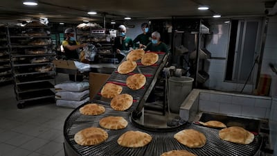 Bread coming off a production line at an automated bakery in Beirut. Russia’s war in Ukraine threatens food supplies in countries such as Lebanon, which depends on the Black Sea region for nearly all of its wheat. AP