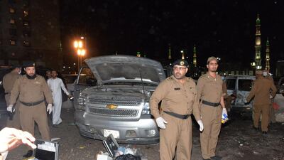 Saudi security personnel gather at the site of the suicide attack near the Prophet's Mosque in Medina on July 4, 2016. AFP