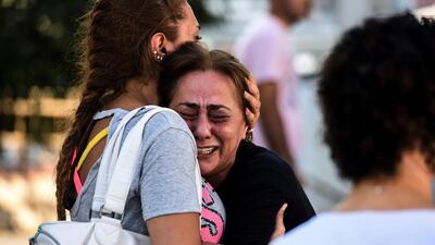 A mother of a victim of the triple suicide bombing and gun attack, that occurred at Istanbul's Ataturk airport, reacts outside a forensic medicine building in Istanbul. Bulent Kilic / AFP