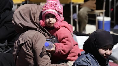 Many of the people fleeing Eastern Ghouta were women and children. Louia Beshara / AFP