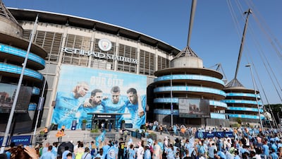 Manchester City fans outside the Etihad Stadium for the victory parade of the men's and women's teams. PA
