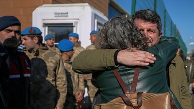 Family members and friends celebrate after a court acquitted nine leading Turkish civil society activists of terrorism-related charges including Osman Kavala, an entrepreneur known for philanthropy who has been jailed for more than two years, in Silivri, outside Istanbul. AP Photo