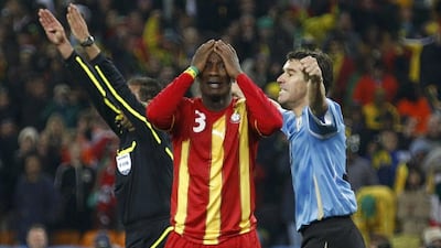 Asamoah Gyan reacts after missing a penalty against Uruguay in the 2010 World Cup quarter-finals. Kai Pfaffenbach / Reuters / July 2, 2010