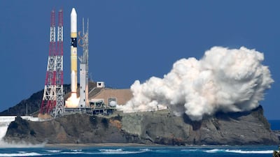Japan's rocket H-IIA, carrying KhalifaSat, is launched, from Tanegashima, southern Japan, on Monday. Nozomi Endo / Kyodo News via AP