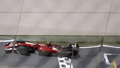 Ferrari F1 driver Kimi Raikkonen of Finland is reflected on a buliding facade during the Austrian Grand Prix on Sunday. David W Cerny / Reuters