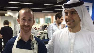 Justin Sanak, winner of The National's second annual bake off extravaganza, with editor-in-chief Mohammed Al Otaiba. Photo by Laura Koot