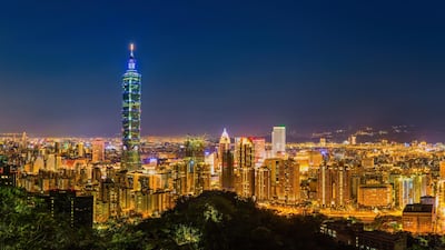 Aerial panorama of Taipei City at dusk, with a view of Taipei 101. Getty Images
