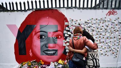 Two women console one another as they look at notes left on a mural of Savita Halappanavar in Dublin on May 26, 2018 as Ireland counted votes from a referendum to repeal a ban on abortion. Charles McQuillan / Getty Images