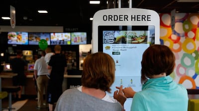 Fingers crossed? Customers use a touchscreen panel to order food at a McDonald’s in Manchester, UK. Paul Thomas / Bloomberg