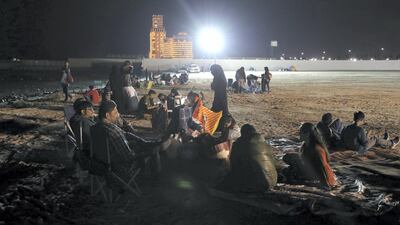 Partygoers at the beach at Ras Al Khaimah. Chris Whiteoak / The National