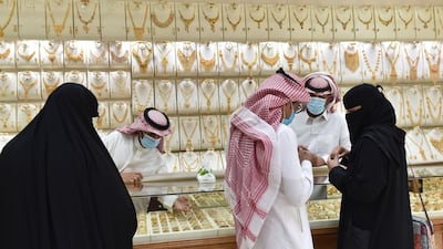 Saudis shop at a jewellery shop in the Tiba gold market in the capital Riyadh. AFP