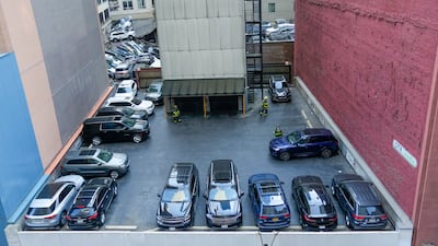 Firefighters attend the scene. AP Photo