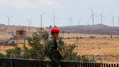 A member of Syria's security forces looks towards the Israeli-occupied Golan Heights from the city of Quneitra. Reuters