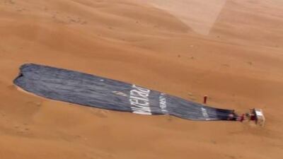 Two people died and one person was seriously injured when this hot air balloon made a crash landing in the desert outside Al Ain during an early morning flight.