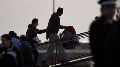 Migrants are deported to Turkey from the port of Mytilene on April 4. Migrants return from Greece to Turkey under the terms of an EU deal that has worried aid groups, as Athens struggles to manage the overload of desperate people on its soil. Aris Messinis / AFP