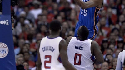 Kevin Durant goes to the basket during the Oklahoma City Thunder's victory over the Los Angeles Clippers in Game 3 on Friday night. Paul Buck / EPA / May 9, 2014