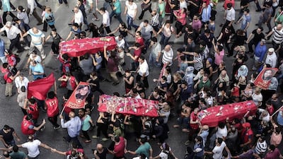 Coffins carried in Gazi, Istanbul, of victims of an ISIL suicide bomb attack in Suruc, southern Turkey, July 2015. Yasin Akgul / AFP.