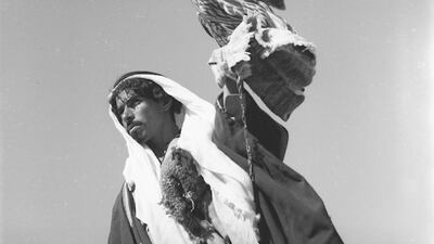A Bedouin carrying a falcon in the Syrian desert, taken by Jibrail Jabbur, gelatin silver negative on film. Norma Jabbur collection, courtesy of the Arab Image Foundation