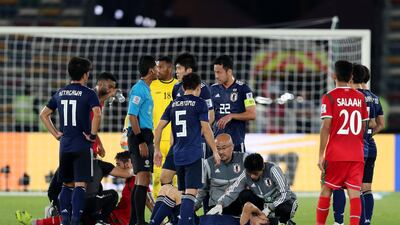 Wataru collides with Muhsen Al Ghassani of Oman. Chris Whiteoak / The National