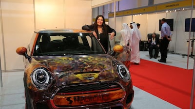 Shalimar Sharbatly with one of her hand-painted creations. Via Twitter