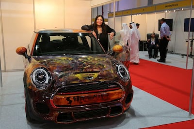 Shalimar Sharbatly with one of her hand-painted creations. Via Twitter