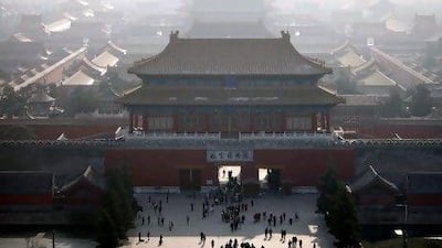 FILE - This Nov. 27, 2009 file photo shows haze clouding the skyline over the forbidden city in Beijing, China. For China, this decade was a time when the massive nation began to reshape the world in both basic and big ways. After spending much of the '80s and '90s with their heads down, retooling their shattered economy, the Chinese started peering beyond the horizon and striding out far beyond their borders. (AP Photo/Elizabeth Dalziel, File) *** Local Caption *** NY612_Decades_End_Chinas_Rise.jpg