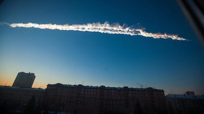 A 2013 file photo shows a meteorite contrail over the Ural Mountains' city of Chelyabinsk, about 930 miles east of Moscow. After it hit at 42,000mph and exploded, smashing windows and causing minor injuries, scientists said the threat of space rocks hurtling towards our planet is bigger than they had thought. AP / Chelyabinsk.ru