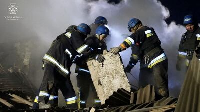 Rescuers remove rubble from the site of the strike on the maternity ward. Reuters