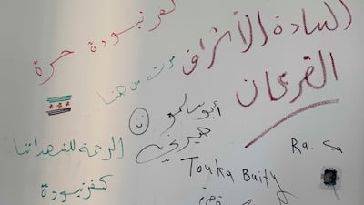 Messages scrawled on the palace walls by Syrians who entered as former president Bashar Al Assad fled a rebel advance on Damascus