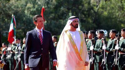 Sheikh Mohammed inspects the guard of honour with Mexican President, Enrique Peña Nieto. PRESIDENCIA / EPA