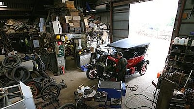 Neil Tuckett, below, has been amassing Model Ts and their parts at his shop in North Marston, England, since he restored his second old Ford in 1981.