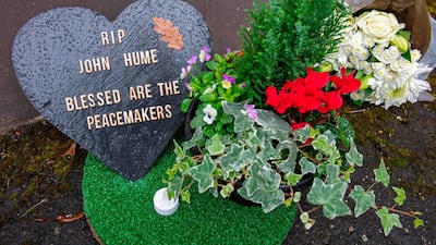 A floral tribute is pictured at the Free Derry wall in the Bogside area for John Hume in Derry. AFP