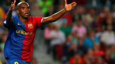 Barcelona's Samuel Eto'o, left, gestures during the match against Racing de Santander.