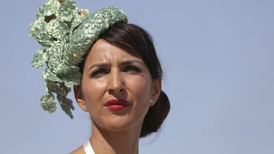 A fan arrives at the Meydan Racecourse ahead of the Dubai World Cup. Kamran Jebreili / AP Photo