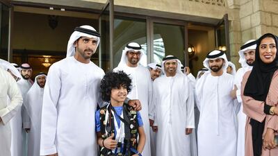 Sheikh Hamdan bin Mohammed, Crown Prince of Dubai, with a young photographer at the Arab Media Forum in Dubai, where the importance of youth to the media was stressed. Wam