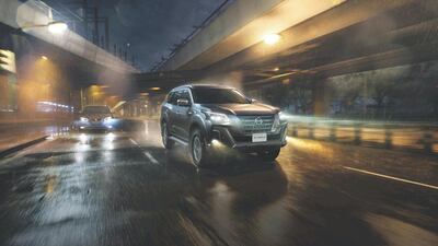 Tearing through damp streets at night.