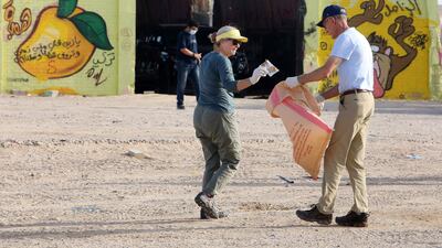 US ambassador to Kuwait, Alina L Romanowski, takes part in a beach clean 60 kilometres north of Kuwait city, to mark World Cleanup Day. AFP