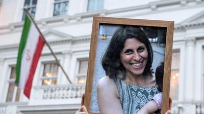 Supporters hold a photo of Nazanin Zaghari-Ratcliffe during a vigil for the British-Iranian mother, who was jailed in September 2016 for allegedly attempting to overthrow the Iranian government. Chris J Ratcliffe/Getty Images