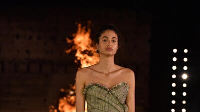 A model walks the runway during the Christian Dior Cruise 2020 show. Getty Images