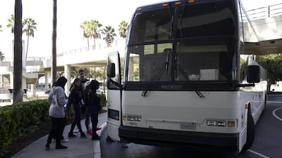 UAE Junior Jiu-Jitsu National Team members get on the bus in front of their hotel in Long Beach, California on Thursday, October 16, 2014. Zachary Patton for The National