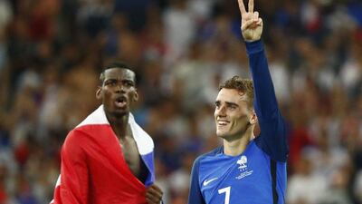 France's Paul Pogba, left, and Antoine Griezmann celebrate at the end of their win over Germany in the Euro 2016 semi-finals. REUTERS/Christian Hartmann