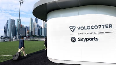 A visitor walks towards the prototype VoloPort in Marina Bay ahead of the Volocopter unmanned air taxi transport test flight during the 26th Intelligent Transport Systems World Congress (ITSWC) in Singapore. AFP