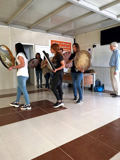 British classical violinist Michael Bochmann MBE has visited the camps to help teach and record the Yazidi music.