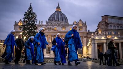 Nuns arrive at dawn to view the body of Pope Emeritus Benedict XVI as it lies in state. AP