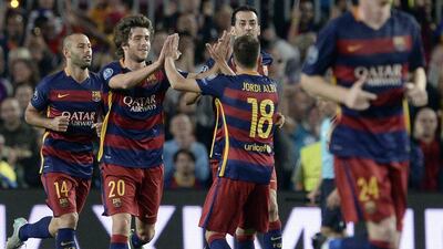 Barcelona's Sergi Roberto celebrates with teammate Jordi Alba after scoring against Bayer Leverkusen on Tuesday night in the Champions League. Josep Lago / AFP
