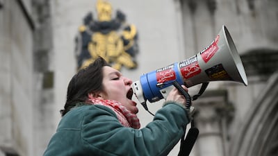 A demonstrator outside the court, where Palestine Action's co-founder Huda Ammori won her challenge on two grounds. Getty Images