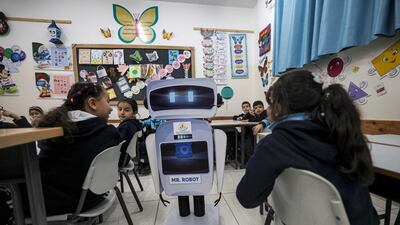 Palestinian pupils with the educational robot.