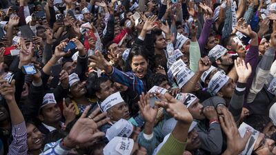 Supporters of the Aam Aadmi Party, or Common Man’s Party, celebrate their party's victory in New Delhi, India. Tsering Topgyal / AP Photo
