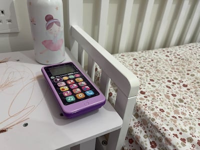 My daughter leaves her dummy phone on her bedside table at night to mimic mama and baba and our nightstand set-ups. Kathryn Balleh / The National