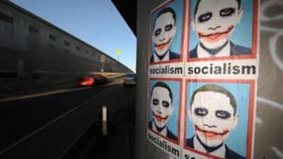 A poster depicting Barack Obama as The Joker, as seen in the Batman movie The Dark Knight pasted on a highway pillar in Los Angeles.